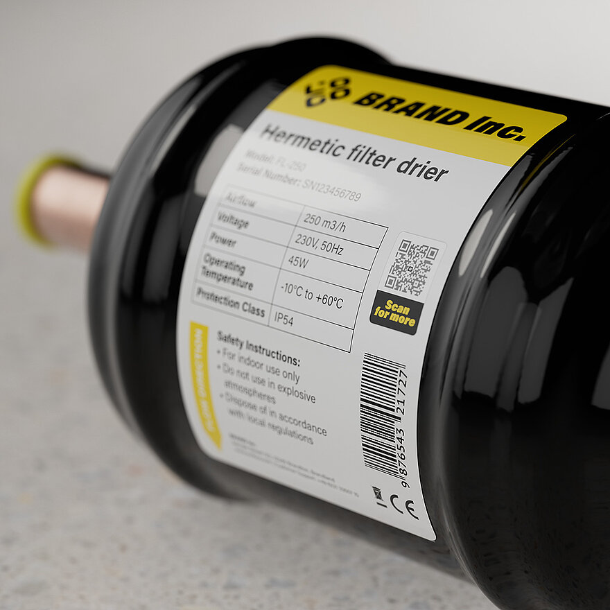 Industrial hermetic filter drier with a product label including technical specifications, barcode, and a QR code for digital verification and additional product information.